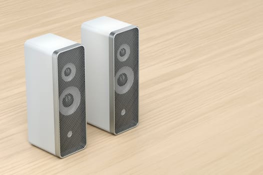 Stereo computer speakers on wooden desk
