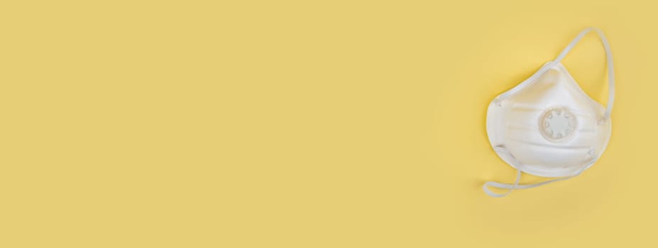 Panorama from Doctor mask and corona virus protection on a yellow background