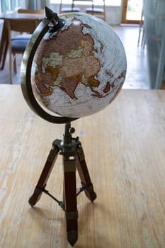 Vintage globe decorated on top of the table, stock photo