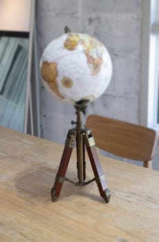 Vintage globe decorated on top of the table, stock photo