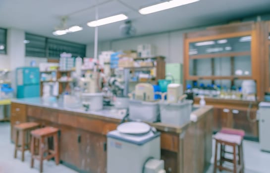 Blurred abstract background of workbench and equipment in chemistry laboratory. Scientific concept image