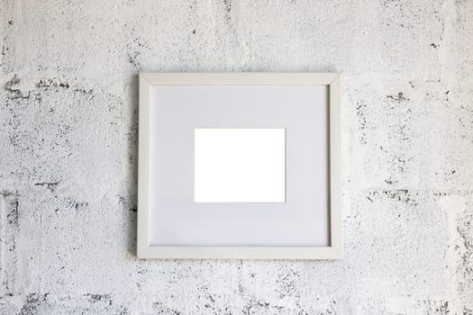 Simply picture frame on white wall, stock photo