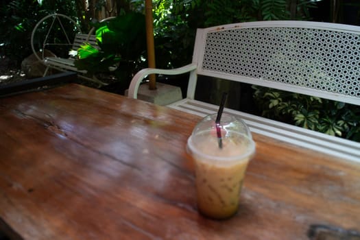 Iced coffee drink in resort garden, stock photo