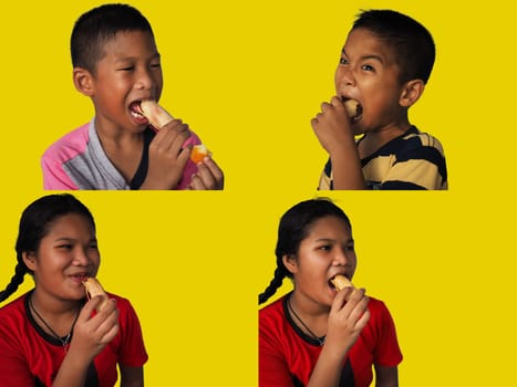 Portrait of a child in Southeast Asia Eating Hot Dog Isolated Yellow Background..Junk food concept..colection images.