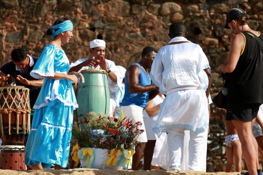 salvador, bahia / brazil - february 2, 2015: supporters of candomble are seen on the Rio Vermelho beach in the city of Salvador during a party in honor of Yemanja.