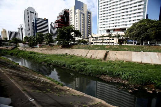 salvador, bahia / brazil - october 2, 2017: sewage channel on the Rio Camurugipe in the Salvador Shopping region in the city of Salvador.