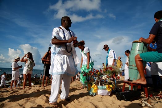 salvador, bahia / brazil - february 2, 2015: supporters of candomble are seen on the Rio Vermelho beach in the city of Salvador during a party in honor of Yemanja.