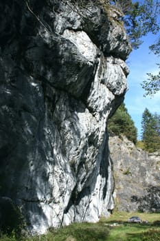A landscape in the highlands, with rocks, trees and blue sky