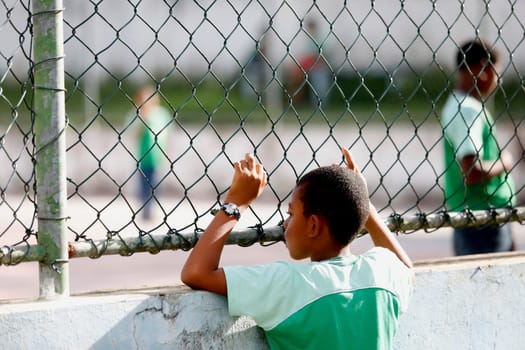 Alagoinhas, bahia / brazil - august 1, 2019: public school student is seen near the school's sports court in the city of Alagoinhas.