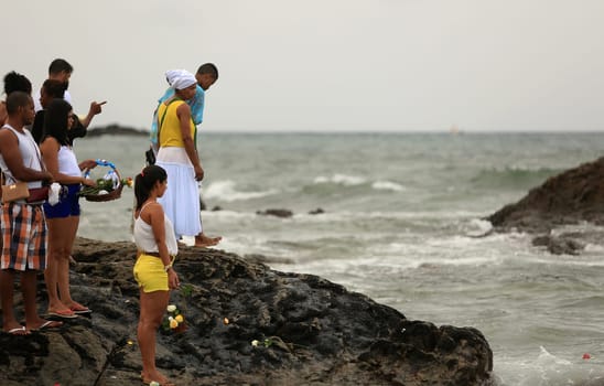 salvador, bahia / brazil - february 2, 2016: supporters of candomble are seen on the Rio Vermelho beach in the city of Salvador during a party in honor of Yemanja.