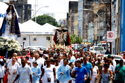 salvador, bahia / brazil - january 1, 2016: member of the catholic church carry images of Bom Jesus dos Navegantes and Nossa Senhora Conceicao da Praia during a procession in the city of Salvador...