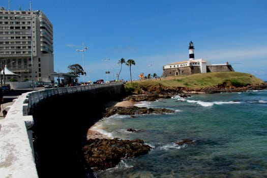 salvador, bahia / brazil - september 25, 2012: view of the beach of the fort of Santo Antonio da Barra, better known as Farol da Barra in the city of Salvador.