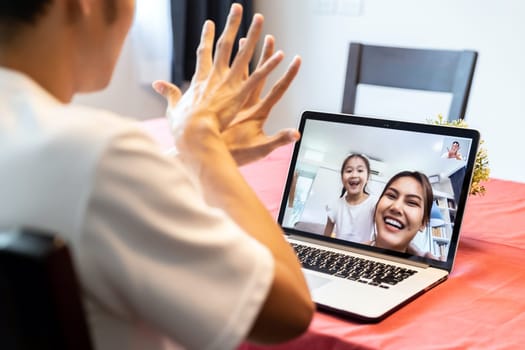 Quarantine father video conference call with his family of mom and daughter while stay in state quarantine. Technology and family reunion new normal while coronavirus covid-19 pandemic.