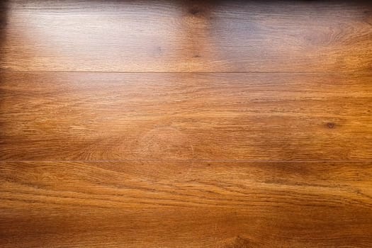 The background is made of wooden table boards. The wooden table is textured.