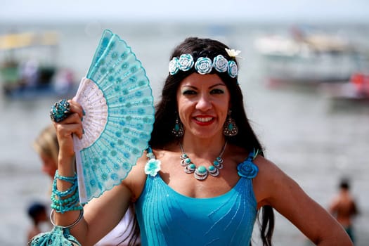 salvador, bahia / brazil - february 2, 2015: supporters of candomble are seen on the Rio Vermelho beach in the city of Salvador during a party in honor of Yemanja.