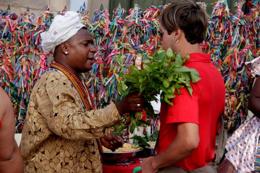 salvador, bahia / brazil - october 7, 2012: candomble priest is seen giving leaves in person in the city of Salvador.