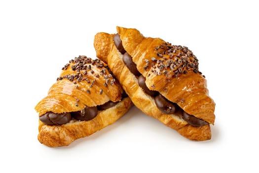 Chocolate croissant sitting over another on a white background