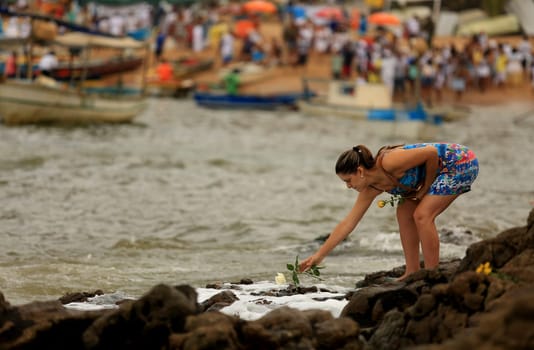 salvador, bahia / brazil - february 2, 2016: supporters of candomble are seen on the Rio Vermelho beach in the city of Salvador during a party in honor of Yemanja.