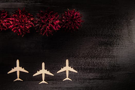 Line of grounded toy planes with COVID-19 virus shapes in front of them, pandemic and economic crisis concept