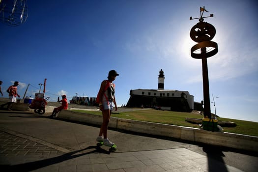 salvador, bahia / brazil - december 1, 2015: person is seen skating along the Farol da Barra in the city of Salvador..
