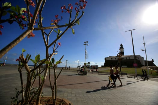 salvador, bahia / brazil - december 1, 2015: people are seen walking near the Farol da Barra in the city of Salvador..