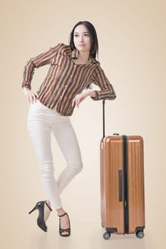 Modern Asian woman stand with a luggage.
