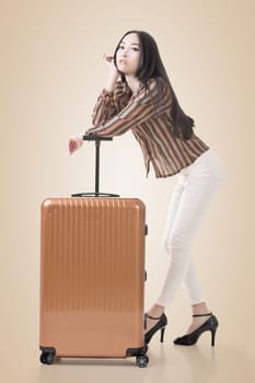 Modern Asian woman stand with a luggage.