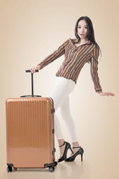 Modern Asian woman stand with a luggage.