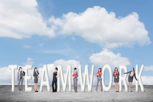 Concept of teamwork with group of business people stand with 3d text.