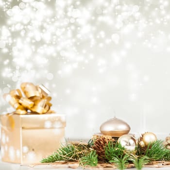 Golden Christmas background with present box on snow
