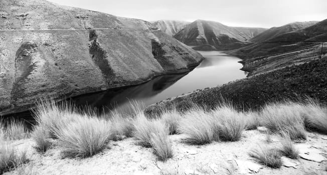 The road overlooks a weathered and historic landscape in the winter Oregon Landscape