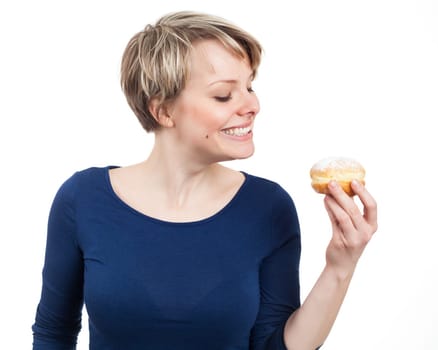 Young woman about to eat a donut, isolated on white