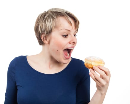 Young woman ready to eat a donut, isolated on white