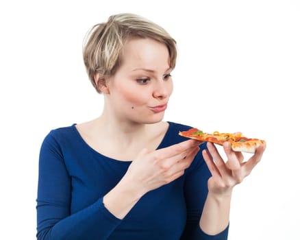 Young woman holding a piece of pizza and ready to eat it, isolated on white