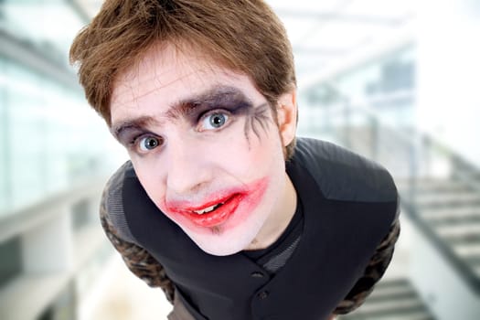 crazy young man dressed as joker