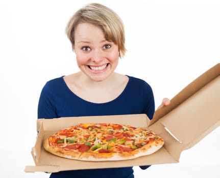 Young woman holding a pizza and looking very happy, isolated on white