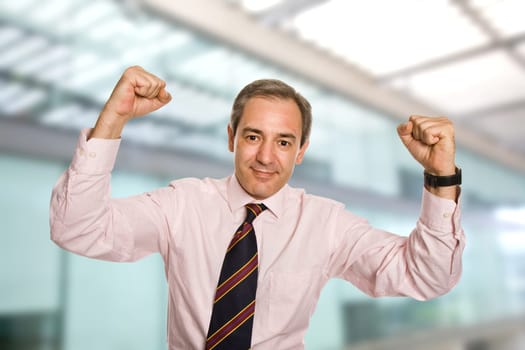 successful business man with open arms as a winner