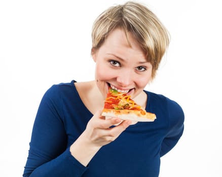 Young woman eating a piece of pizza, isolated on white