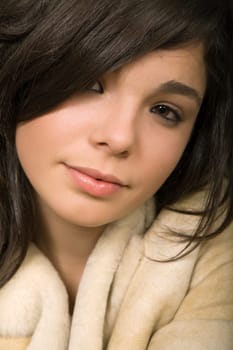 young beautiful brunette portrait against black background