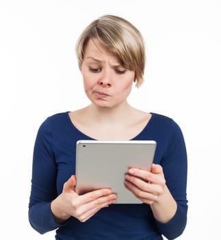 Young woman using an electronic tablet, isolated on white