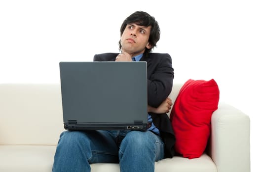 young man working with laptop in a couch