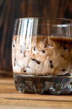 Glass of White Russian cocktail. Combining vodka, coffee liqueur and cream.