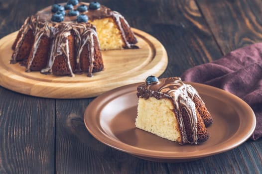 Lemon cake wedge with chocolate topping