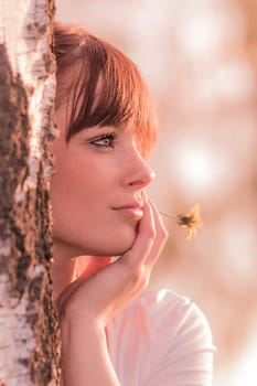 Young carefree woman with best health at sunny summer day in youth time. Perfect skin with authentic natural beauty cosmetic makeup.