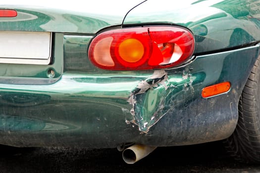 Close up shot of crashed car bumper.