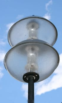 a street lamp with a two, spherical glass bodys