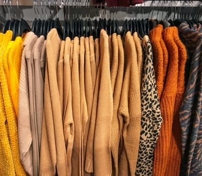 Different types of winter sweaters for sale at a nearby store