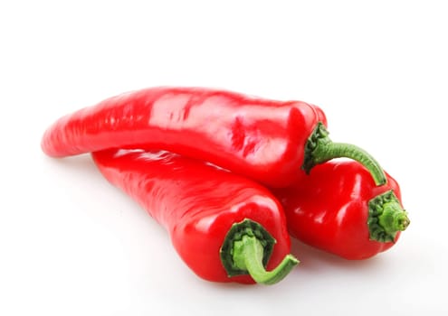 Close-Up Of Red Chili Pepper Against White Background