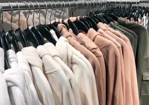 Different types of winter sweaters for sale at a nearby store