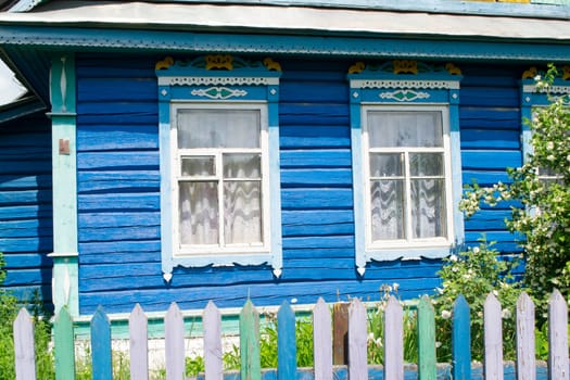 Carved windows in old national wooden ancient country house in Belarus